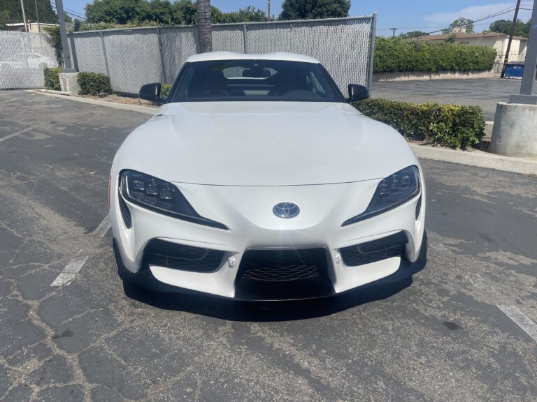 Front View of a 2024 Toyota Supra, super sport 4 door coupe in white